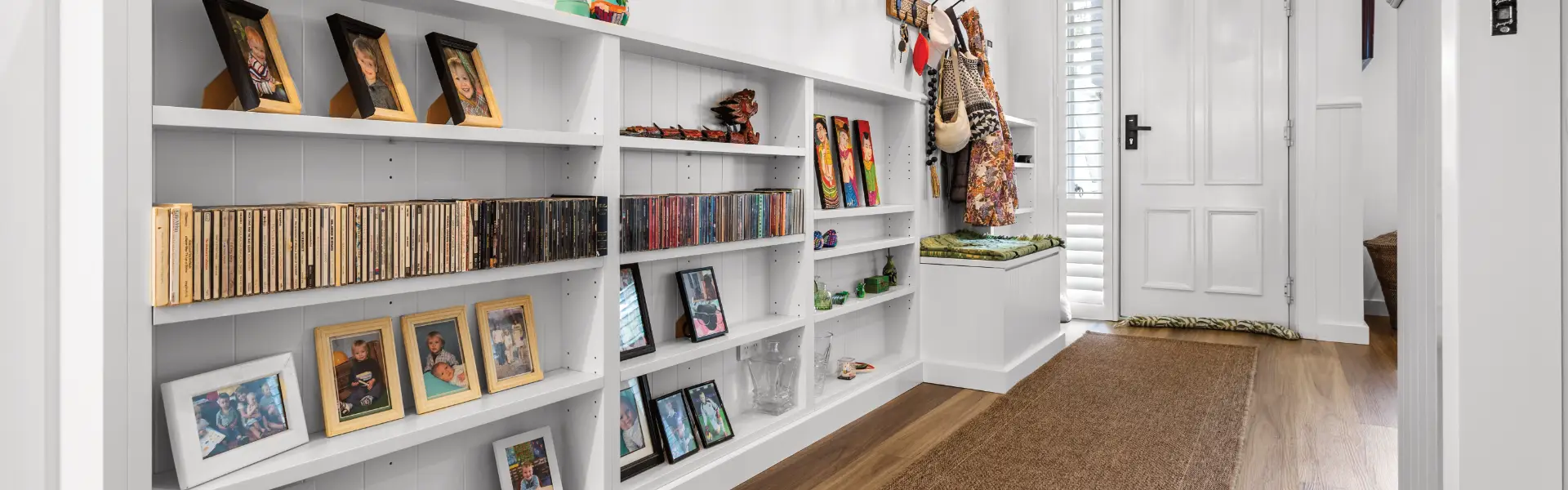 bespoke white shelving is entrance hall
